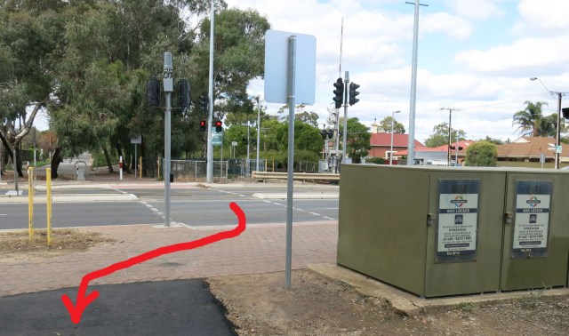 Outer Harbour Greenway: Unfortunately the transition from the bicycle & pedestrian crossing on Woodville Road to the new pathway is not as direct as it could be. The green boxes are bike lockers associated with the nearby rail station. They could perhaps have been moved...