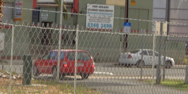 Car exiting the Greenway path using the Lipson Street ramp.